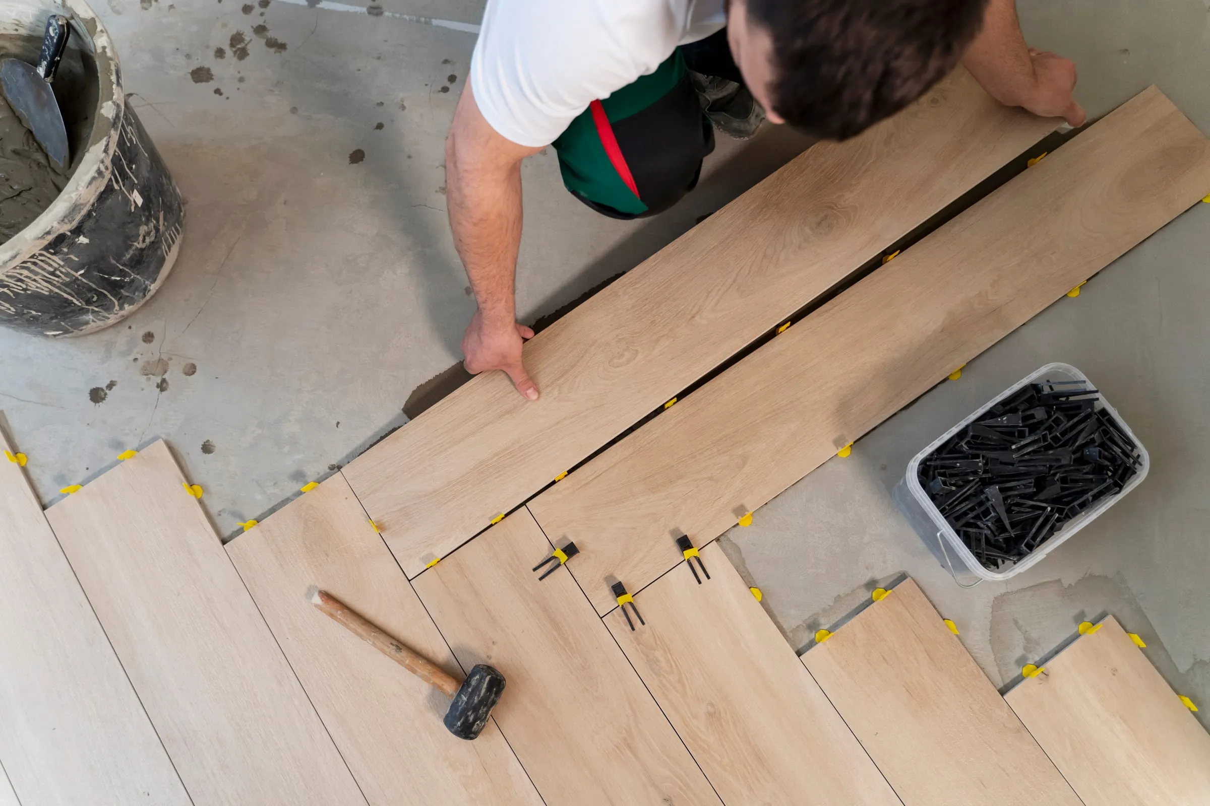 Craftsman laying a new floor